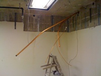 Infrastructure line routed through the vault wall