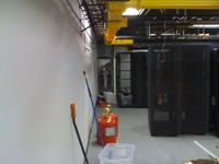 Fiber tray running along datacenter wall