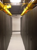 Rack aisle with overhead yellow fiber trays