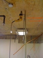 Hammer drill rig used for ceiling installation